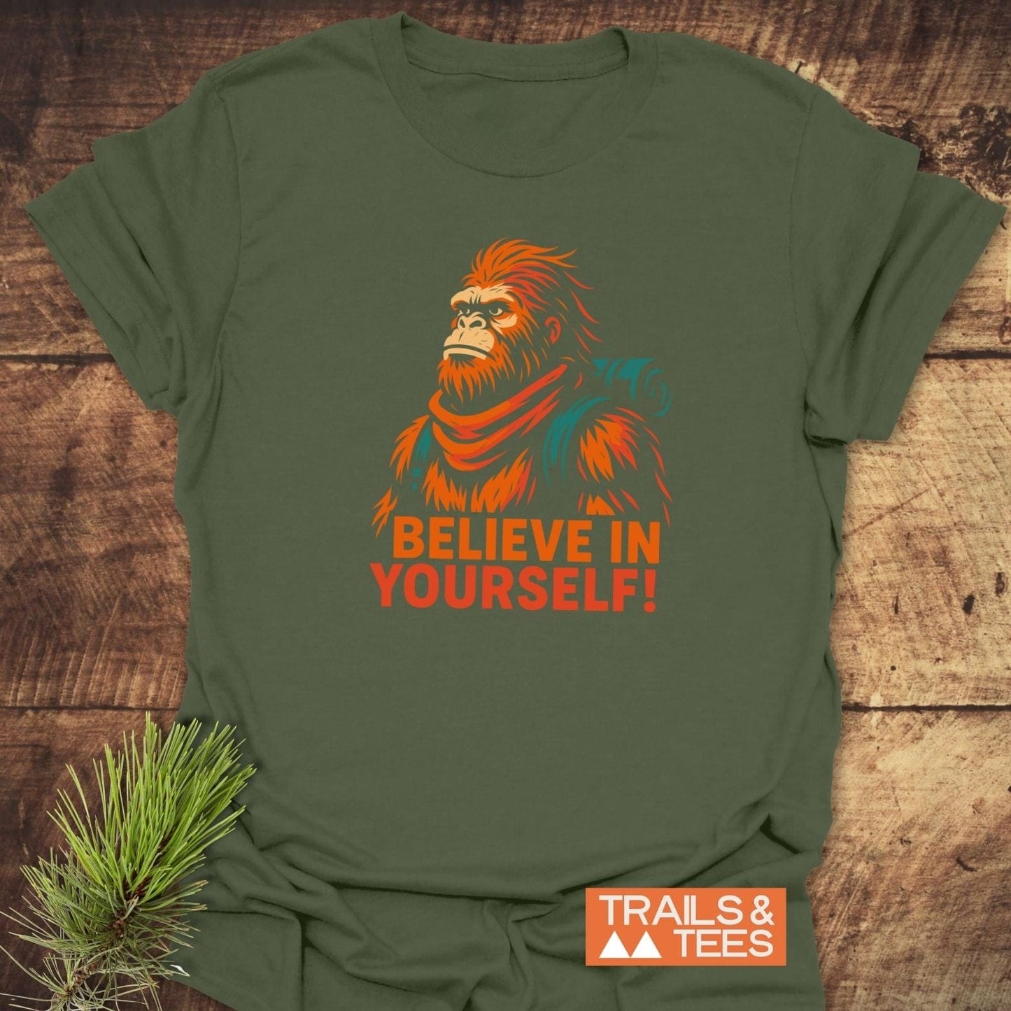 Believe In Yourself Bigfoot T-Shirt featuring a stylized Bigfoot illustration with a scarf, perfect for outdoor enthusiasts, crafted from soft ring-spun cotton for lasting comfort.