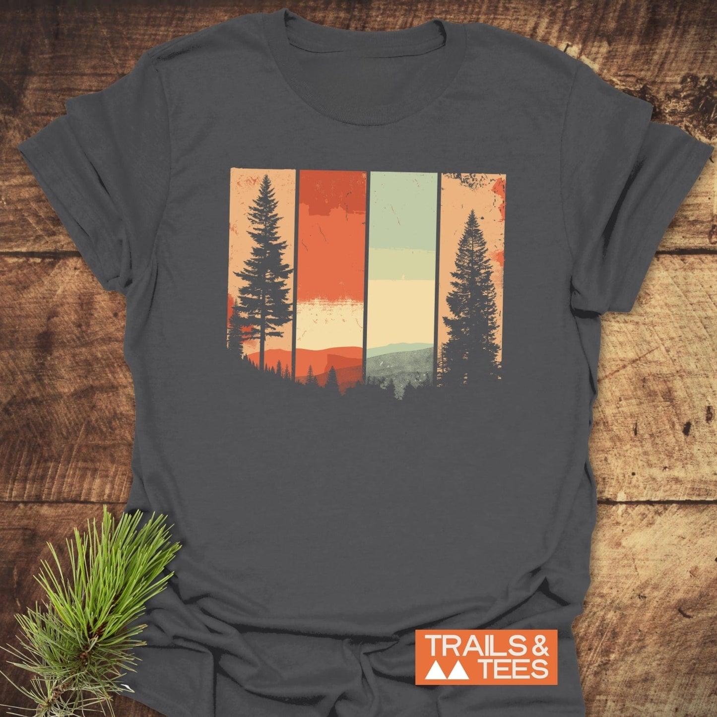 Striped Mountains Retro T-Shirt featuring a stylized forest scene with pine tree silhouettes, crafted from lightweight cotton for comfort and durability, ideal for outdoor enthusiasts.