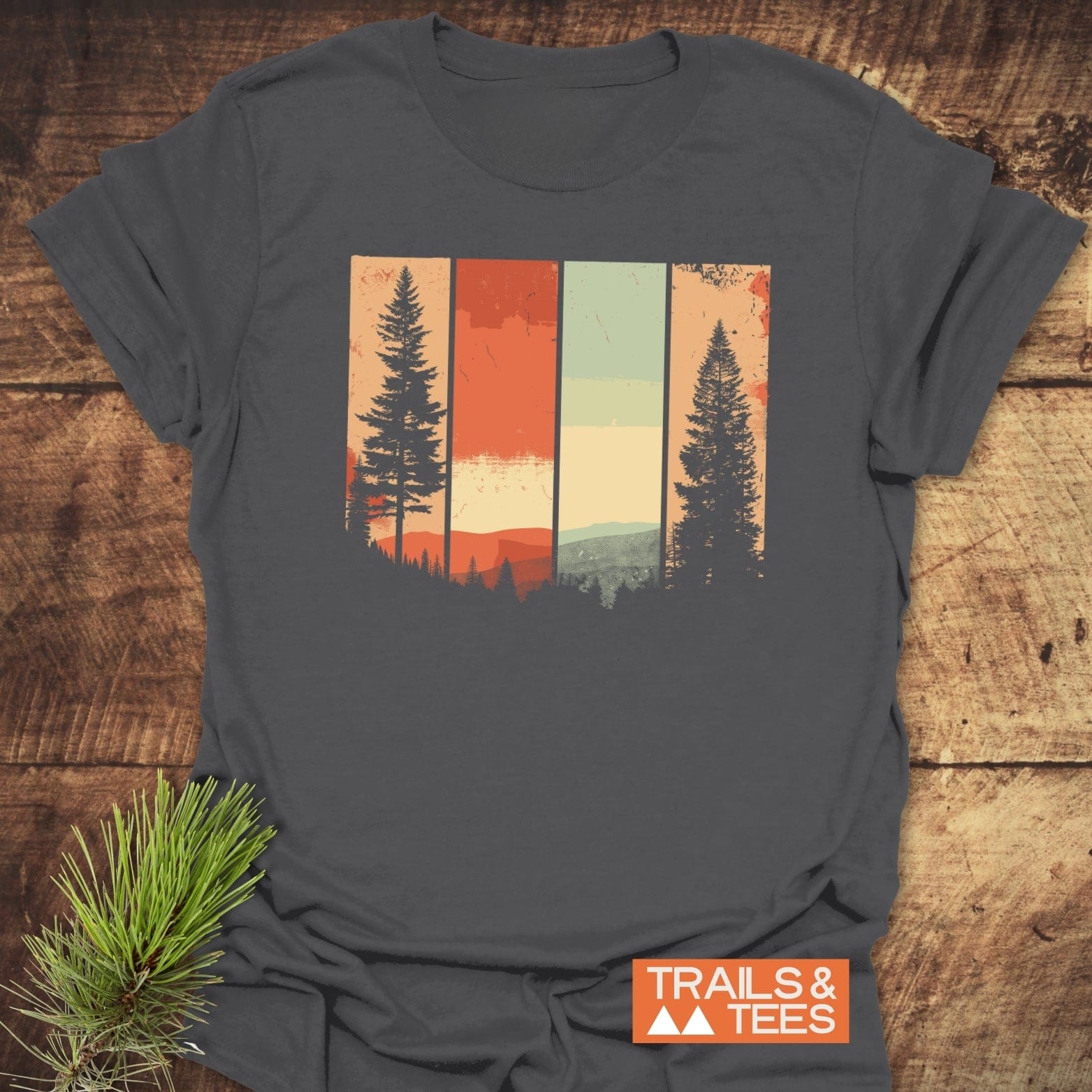 Striped Mountains Retro T-Shirt featuring a stylized forest scene with pine tree silhouettes, crafted from lightweight cotton for comfort and durability, ideal for outdoor enthusiasts.