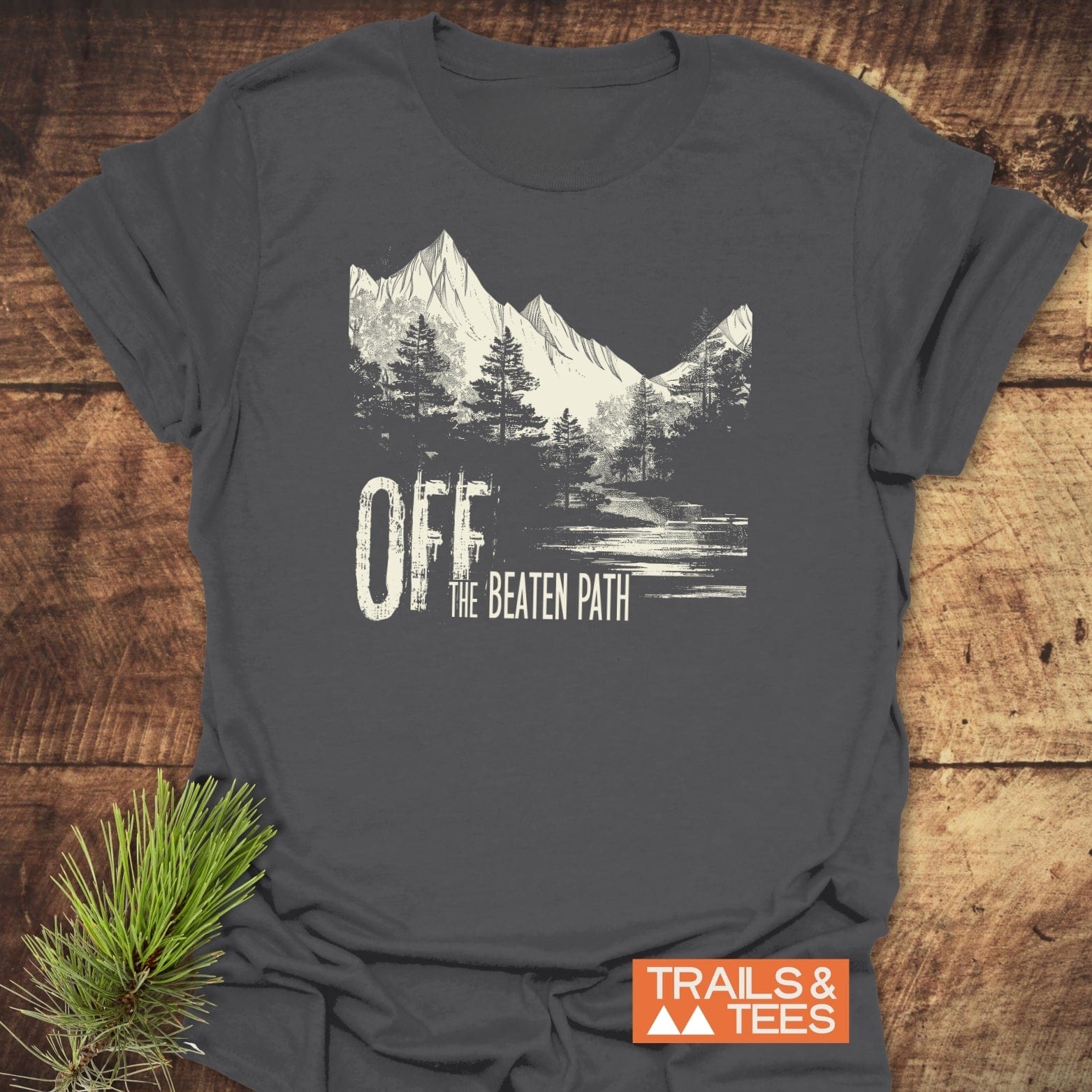 Off The Beaten Path T-Shirt displaying a distressed mountain and forest graphic, emphasizing adventure, crafted from soft ring-spun cotton with durable prints and a reliable fit.