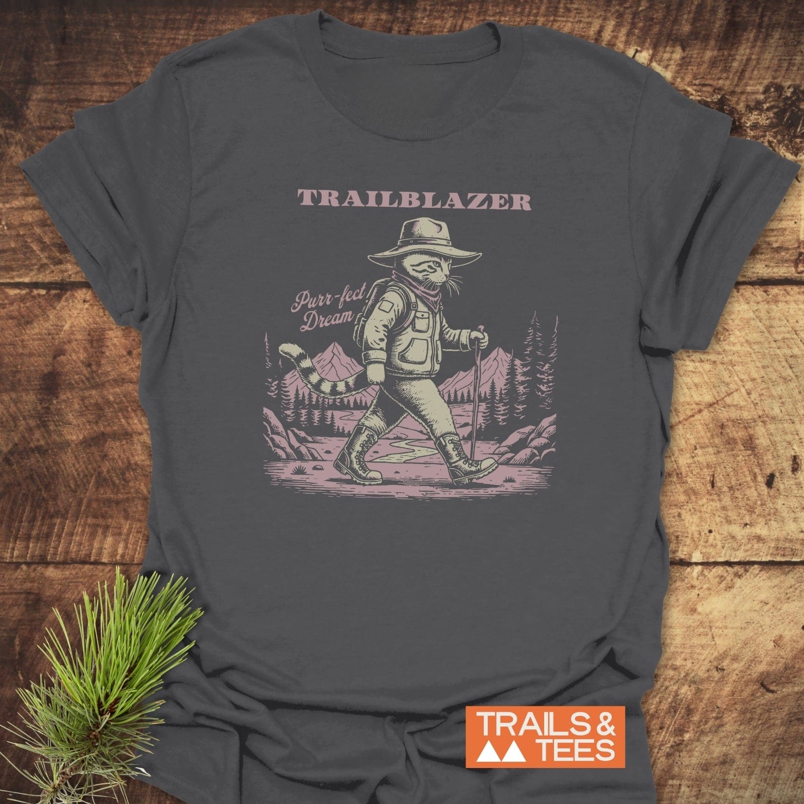Purr-fect Dream Hiking T-Shirt features a vintage-style hiker cat illustration with TRAILBLAZER text, crafted from soft, durable cotton for outdoor enthusiasts.
