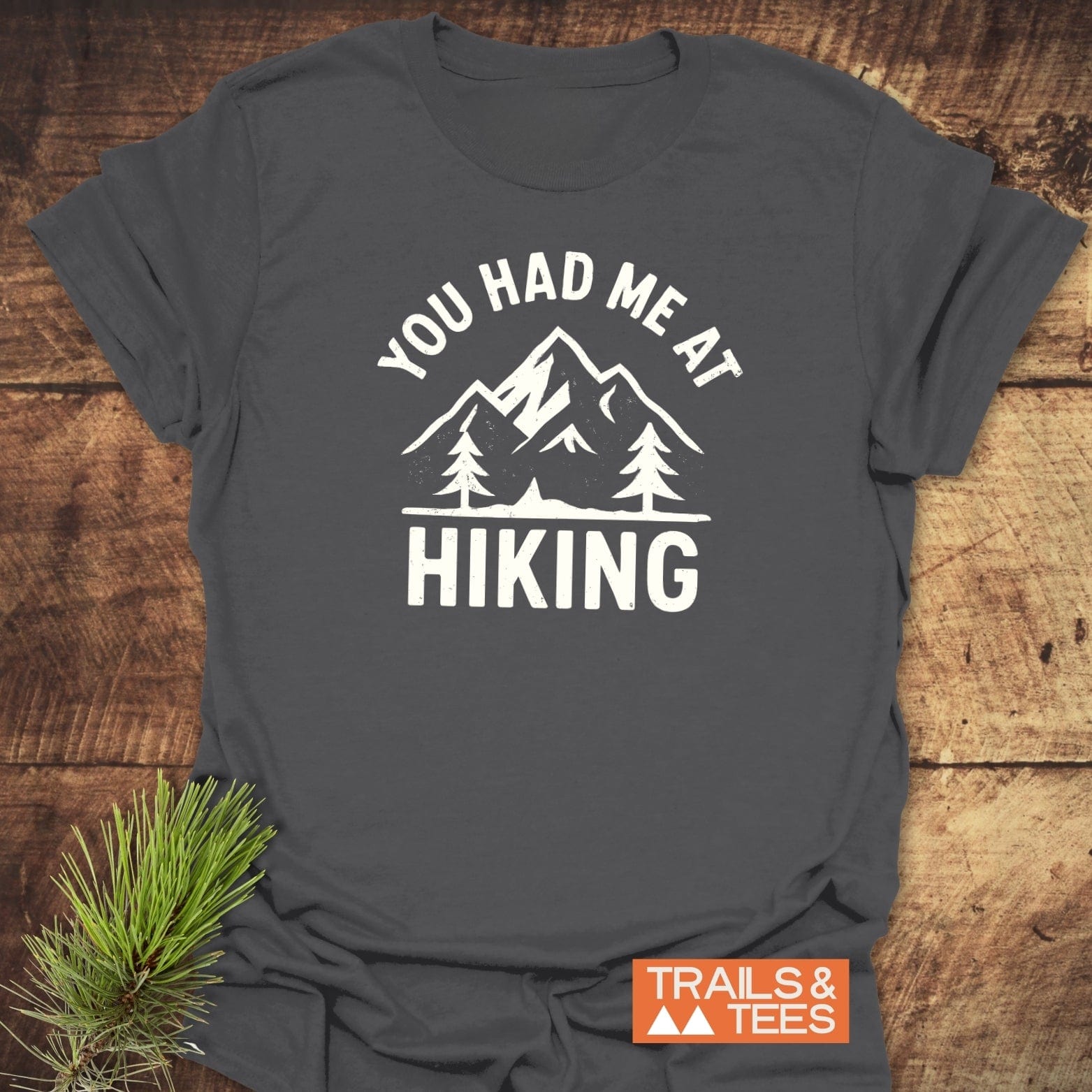 You Had Me At Hiking T-Shirt with mountain graphic, crafted from soft cotton, featuring durable prints and taped shoulders for lasting comfort.