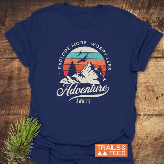 Adventure Awaits Retro T-Shirt featuring a mountain graphic with sunset and birds, navy-blue color, soft cotton, durable print, ideal for outdoor enthusiasts.