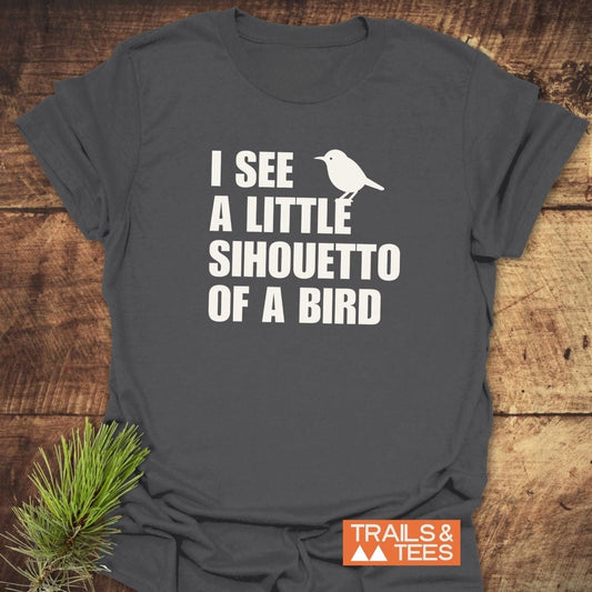 Silhouetto Of A Bird Funny T-Shirt with white bird silhouette and slogan on dark-gray fabric, highlighting durable, comfortable design by Trails & Tees.