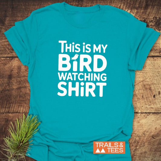 Teal Bird Watching T-Shirt featuring white text and a bird icon. Made from soft ring-spun cotton, designed for outdoor enthusiasts.