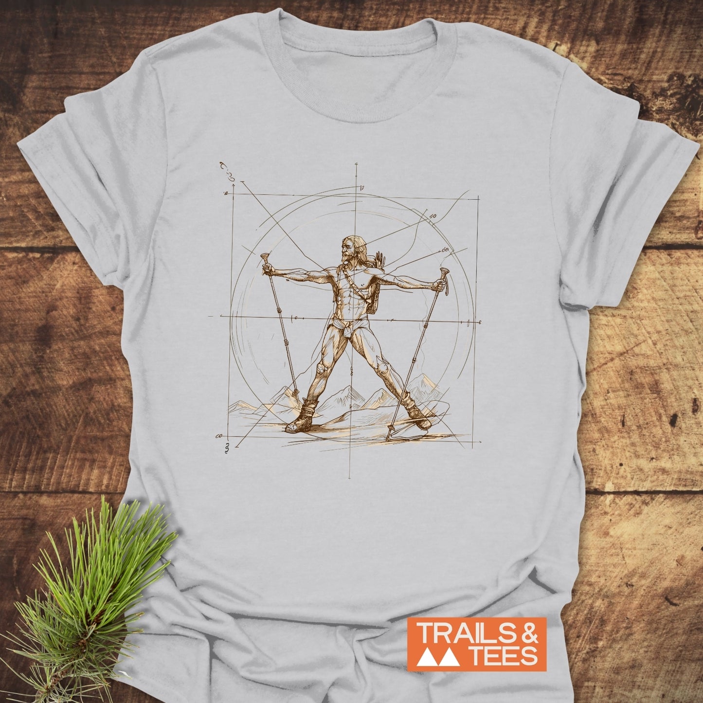 Vitruvian Hiker Da Vinci Style T-Shirt featuring a sepia sketch of a backpacker in a Vitruvian pose, surrounded by mountain elements and compass lines, embodying outdoor adventure spirit.