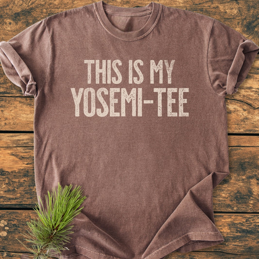 This Is My Yosemi-Tee - Vintage Wash Tee features a heathered crew-neck with off-white slogan, laid on wood, pine sprig accentuating the outdoorsy theme. Made from soft, durable, garment-dyed cotton.