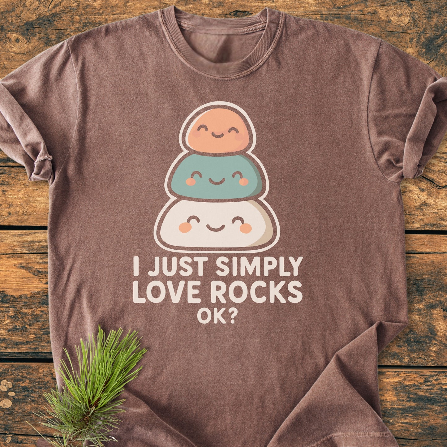 I Just Simply Love Rocks OK? - Vintage Wash Tee displayed on wood, featuring cartoon rocks graphic and playful caption. Made from soft, garment-dyed, ring-spun cotton for relaxed fit and comfort.