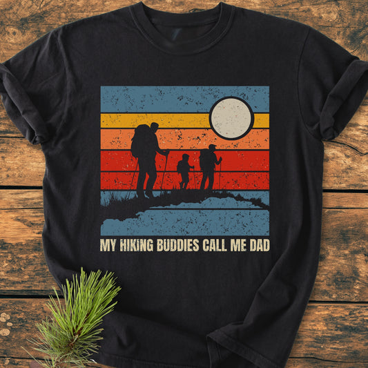 My Hiking Buddies Call Me Dad - Vintage Wash Tee features a retro sunset graphic with hikers. Crafted from soft, durable 100% ring-spun cotton, it offers a relaxed fit, perfect for everyday wear.