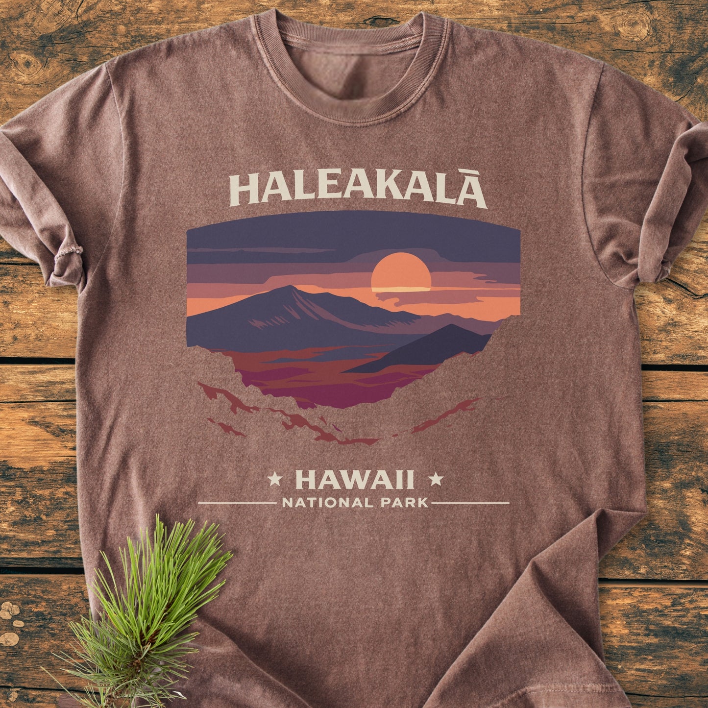 Haleakala National Park - Vintage Wash Tee displayed flat, featuring a sunset graphic of Haleakalā. Made from soft, pre-shrunk 100% ring-spun cotton, the shirt promises comfort and durability.