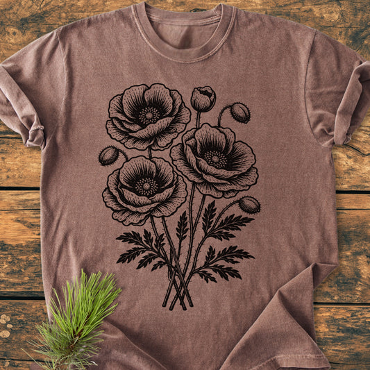 Poppy Bouquet - Vintage Heavyweight Tee features a hand-drawn poppy illustration on a brown tee, laid on wood. Made of soft, garment-dyed cotton with a relaxed fit for daily comfort.