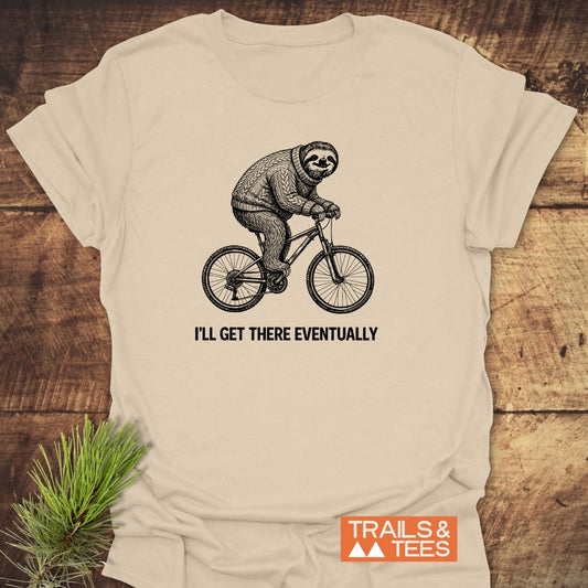 I'll Get There Eventually T-Shirt features a sloth on a bicycle design, crafted from soft, ring-spun cotton for comfort. Ideal for outdoor enthusiasts, with durable prints and a sustainable production ethos.