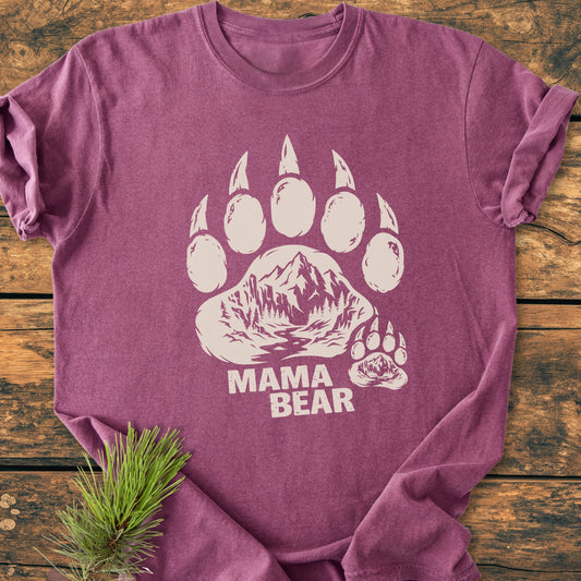 Mama Bear - Vintage Heavyweight Tee features a stylized bear paw with a mountain scene on a soft, ring-spun cotton shirt, laid flat, showcasing its durable, relaxed fit.