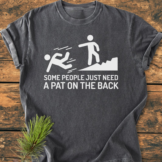 Some People Just Need A Pat On The Back - Vintage Wash Tee features a white graphic of stick figures with a witty caption, on a relaxed-fit charcoal-gray T-shirt, laid flat on a wood surface.