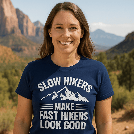 Woman outdoors wearing Slow Hikers T-Shirt with mountain graphic, emphasizing comfort and durability for everyday adventures.