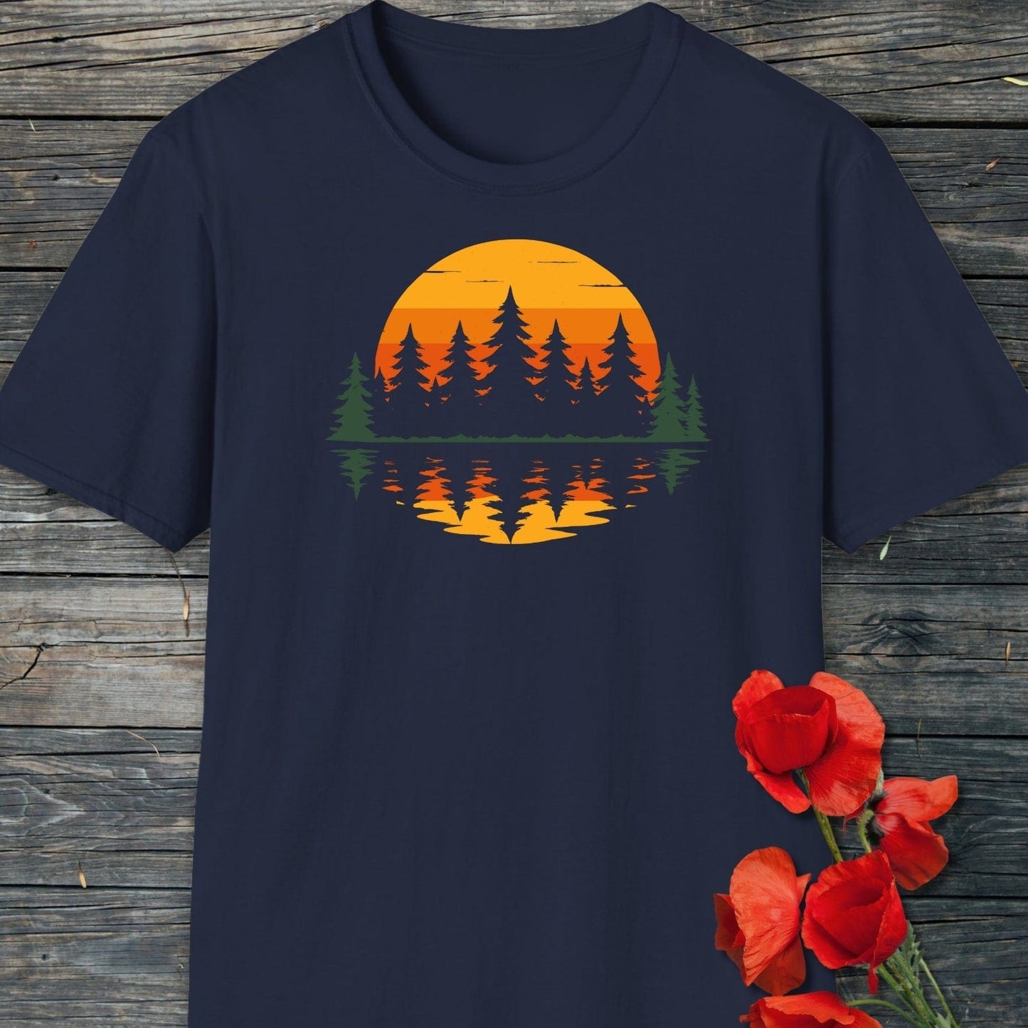 Retro Sunset Pines T-Shirt: dark-navy tee with a forest silhouette and sunset print, laid flat, showcasing soft, ring-spun cotton and durable design.