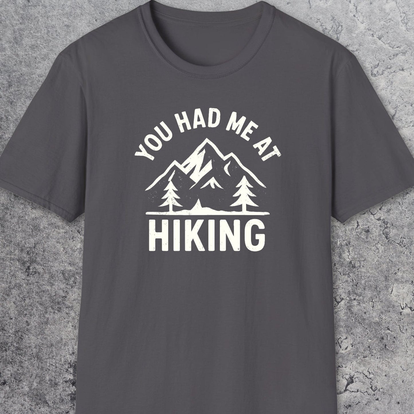 You Had Me At Hiking T-Shirt featuring a mountain and pine tree graphic, perfect for outdoor enthusiasts, crafted from soft, lightweight cotton for comfort and durability.