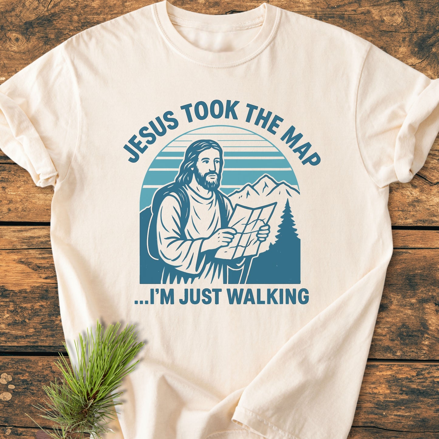 Jesus Took The Map - Vintage Wash Tee features a playful graphic of Jesus with a map, ideal for outdoor enthusiasts. Made from soft, durable 100% ring-spun cotton, offering a relaxed fit.