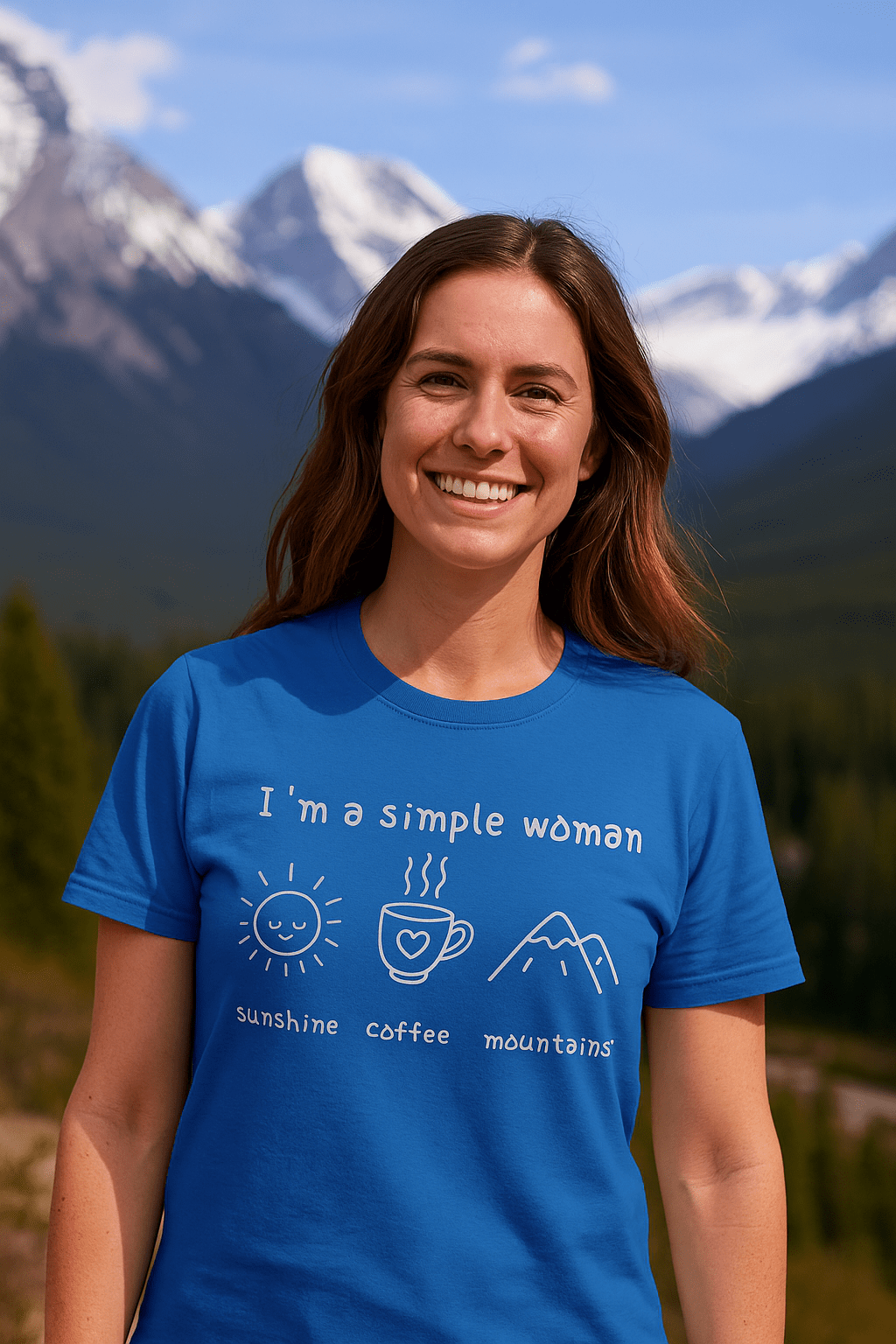 Person outdoors wearing the I'm A Simple Woman - Sunshine Coffee Mountains T-Shirt with icons of a sun, coffee cup, and mountains, embodying simple joys.