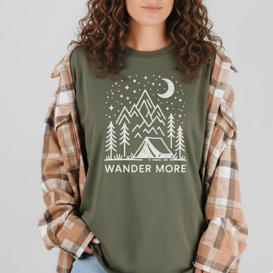 Wander More T-Shirt featuring a camping scene line-drawing, crafted from soft cotton for comfort, ideal for outdoor enthusiasts seeking durability and style.