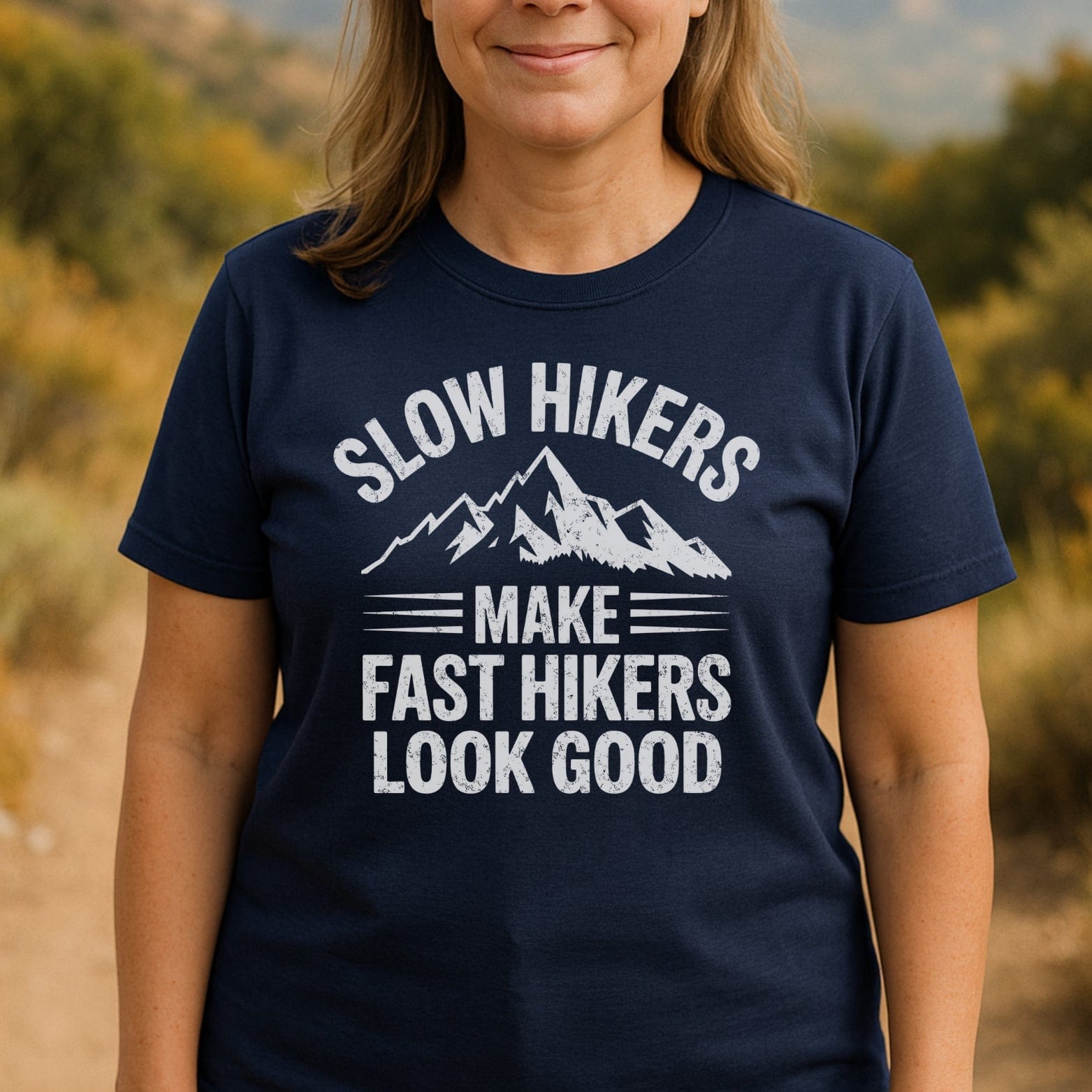Person wearing a Slow Hikers T-Shirt with a mountain graphic and slogan, designed for comfort and adventure.