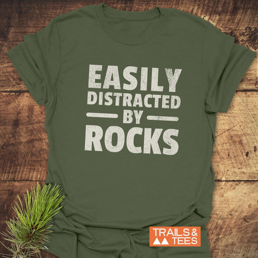 Easily Distracted By Rocks T-Shirt, featuring durable, crack-resistant prints on a soft, lightweight cotton fabric, designed for comfort and outdoor adventures.