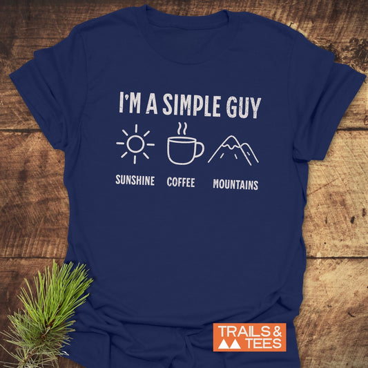 I'm A Simple Guy - Sunshine Coffee Mountains T-Shirt featuring white text on an activewear blue shirt, ideal for casual and outdoor settings.