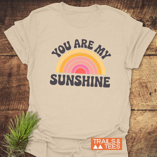 Close-up of the You Are My Sunshine T-Shirt featuring intricate text design, emphasized against a simple backdrop, showcasing its activewear style.