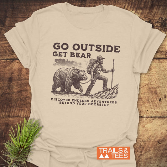 Go Outside Get Bear T-Shirt featuring a black and white drawing of a man and bear, ideal for outdoor enthusiasts seeking an active lifestyle.