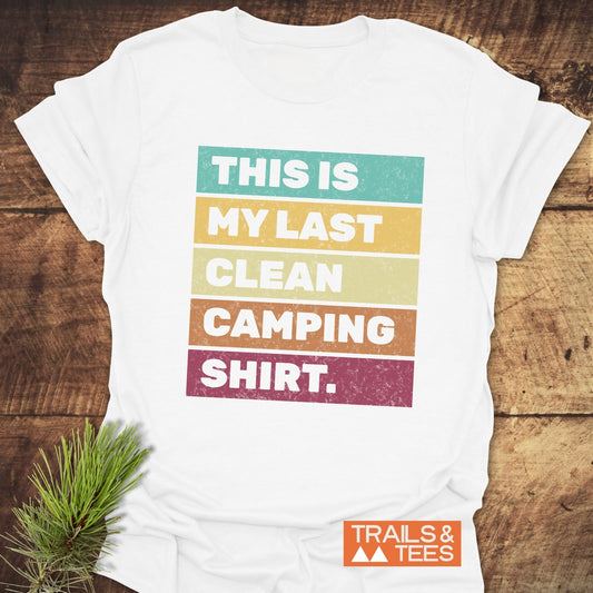 My Last Clean Camping Shirt close-up with white text on a brown sign, featuring subtle plant elements, showcasing the shirt's playful, outdoorsy theme.