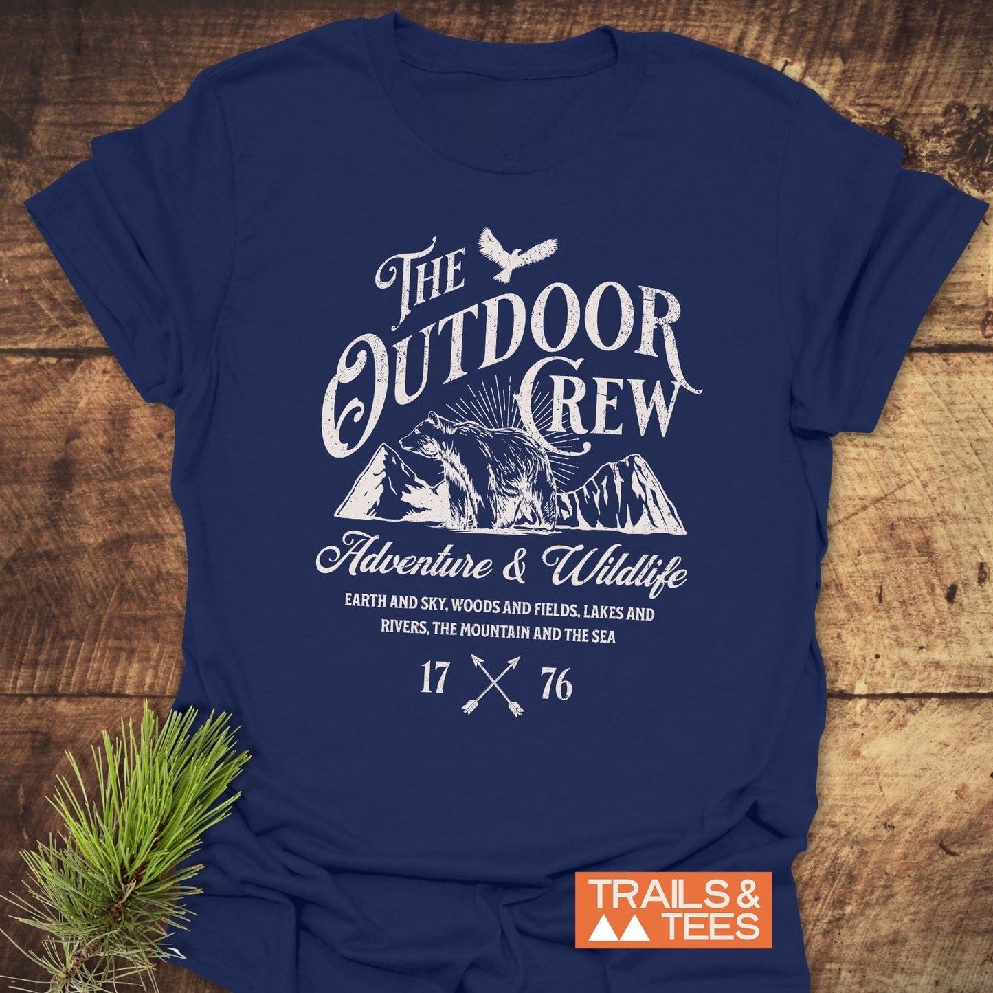 The Outdoor Crew Vintage T-Shirt featuring white text on a blue shirt, designed for comfort and durability with a focus on outdoor adventures.