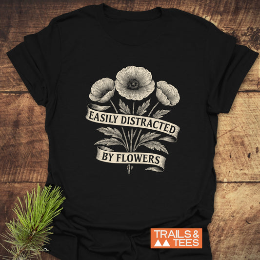 Easyly Distracted By Flowers T-Shirt featuring a black base with white floral design, crafted from soft, lightweight cotton for comfort and durability.