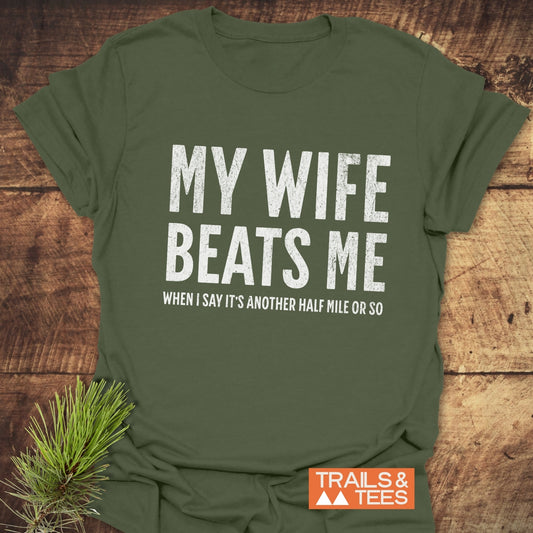 My Wife Beats Me T-Shirt: Soft, lightweight ring-spun cotton with durable DTF prints, designed for outdoor adventures. Pre-shrunk, taped shoulders, no side seams.