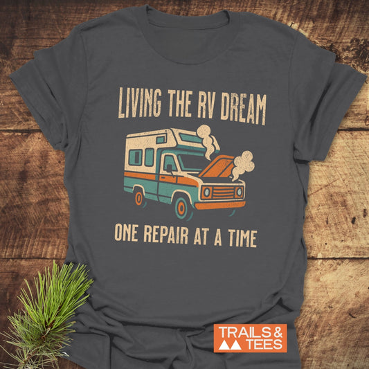 Living The RV Dream T-Shirt featuring a camper graphic, perfect for adventure enthusiasts. The design captures the essence of a nomadic lifestyle.
