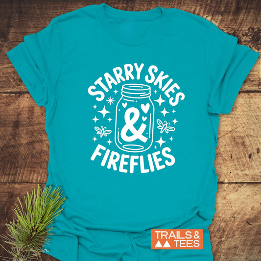 Starry Skies & Fireflies T-Shirt featuring a close-up of a white star logo and bold white text on a blue fabric, highlighting its activewear design.