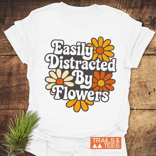 Easily Distracted By Flowers T-Shirt featuring durable orange and white floral prints on soft, lightweight cotton, designed for comfort and outdoor adventures.