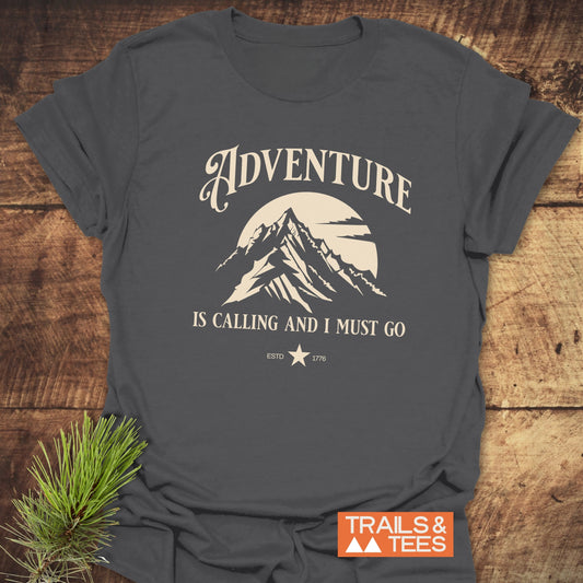 Close-up of the Adventure Is Calling T-Shirt, featuring a durable print on soft, lightweight ring-spun cotton, ideal for outdoor enthusiasts.