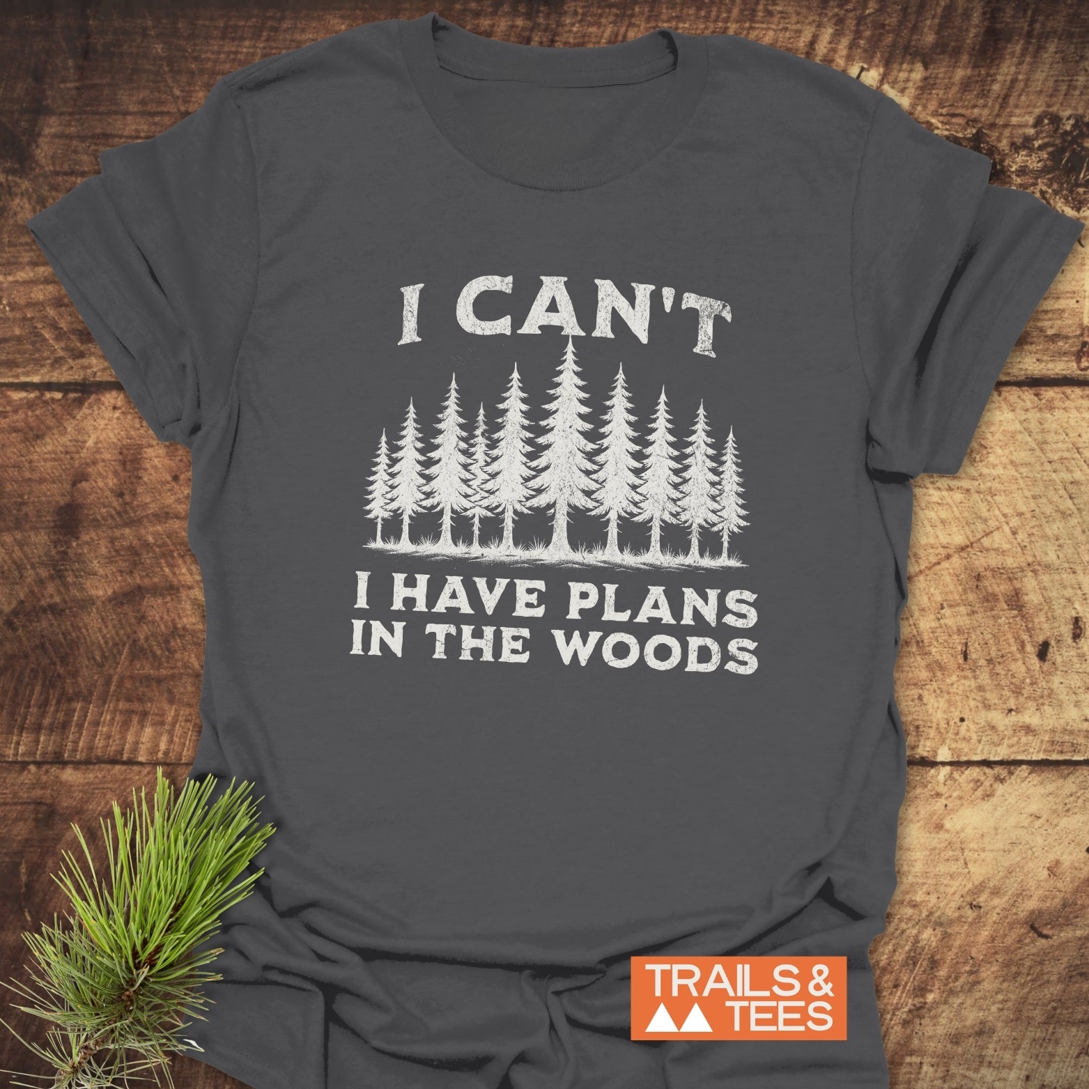 I Can't I Have Plans T-Shirt, showcasing durable white text on a grey tee, perfect for outdoor enthusiasts, made with soft ring-spun cotton for comfort.