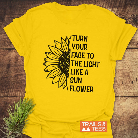 Turn Your Face To The Light T-Shirt featuring a sunflower design; crafted from lightweight, ring-spun cotton with durable DTF prints, ideal for outdoor adventures.