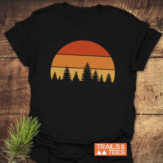 Forest Sunset T-Shirt featuring a silhouette of a tree and orange circle, crafted from soft cotton, designed for comfort and durability in outdoor adventures.