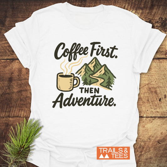 Coffee First Then Adventure T-Shirt featuring mountain and coffee cup graphic, crafted from soft cotton for comfort and durability, ideal for outdoor enthusiasts.