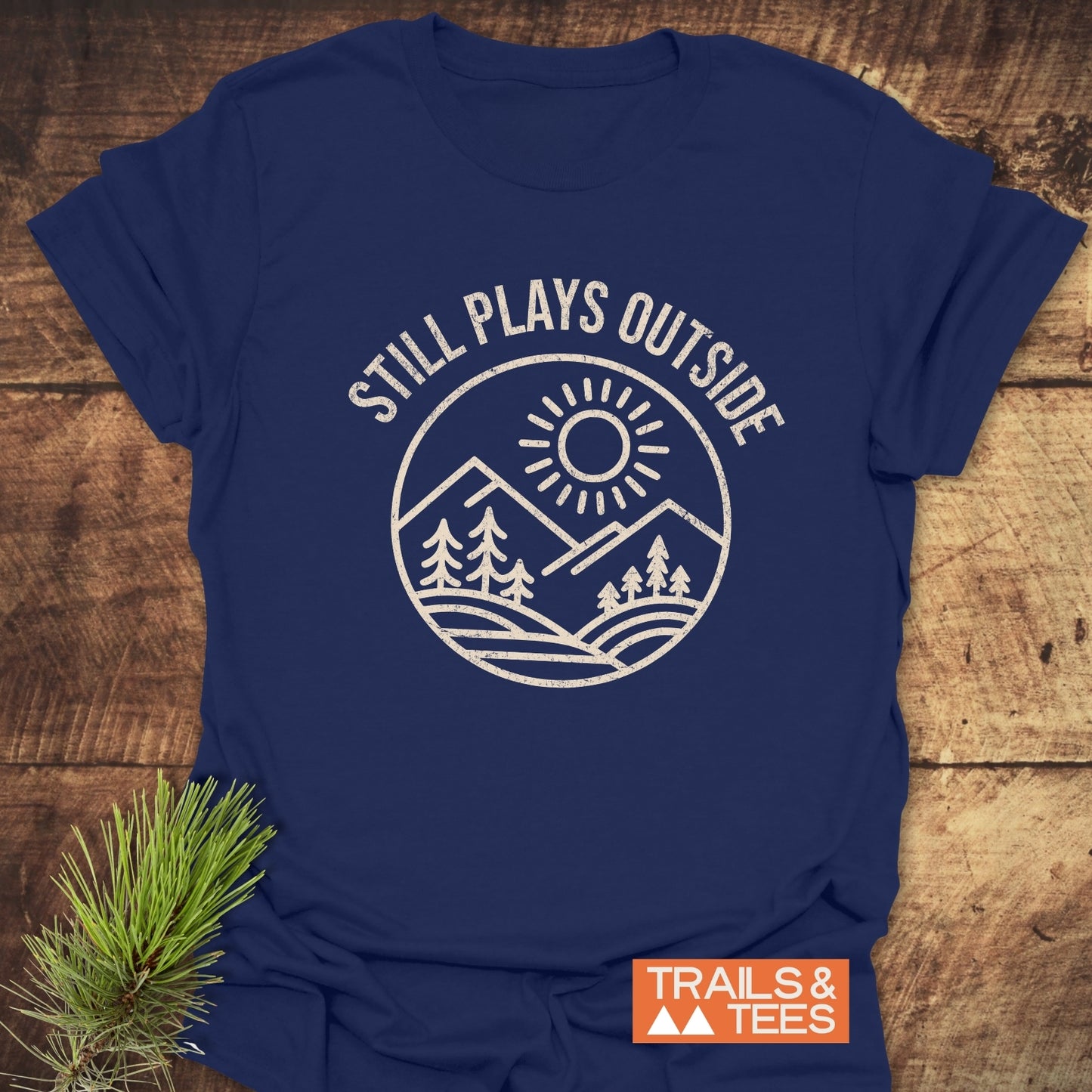 Still Plays Outside T-Shirt, featuring durable white text on a blue active shirt, designed for comfort with soft ring-spun cotton and no side seams.