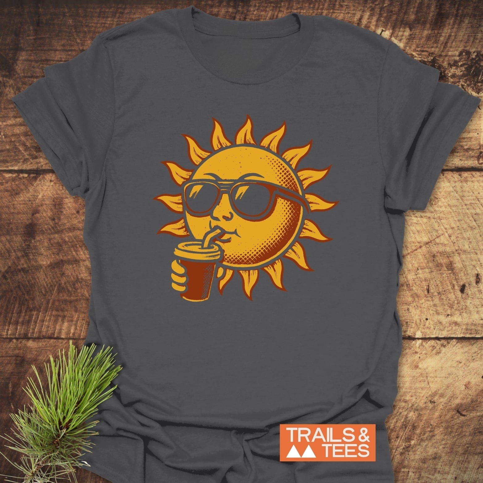 Sun With Coffee T-Shirt featuring a sun wearing sunglasses, sipping from a straw. Made from soft, lightweight cotton for comfortable, everyday outdoor adventures.