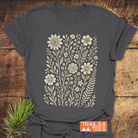 Wild Flowers T-Shirt featuring white floral design on grey fabric, crafted from soft ring-spun cotton for comfort and durability, ideal for outdoor adventures.