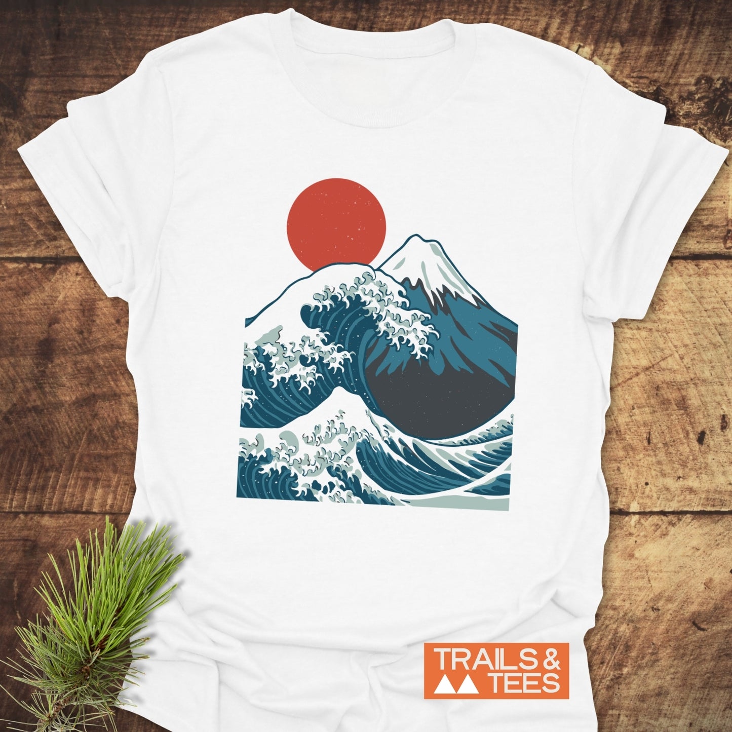 Mountain And Wave T-Shirt: close-up of a white tee featuring a mountain and red sun design, crafted from lightweight, ring-spun cotton for comfort and durability.
