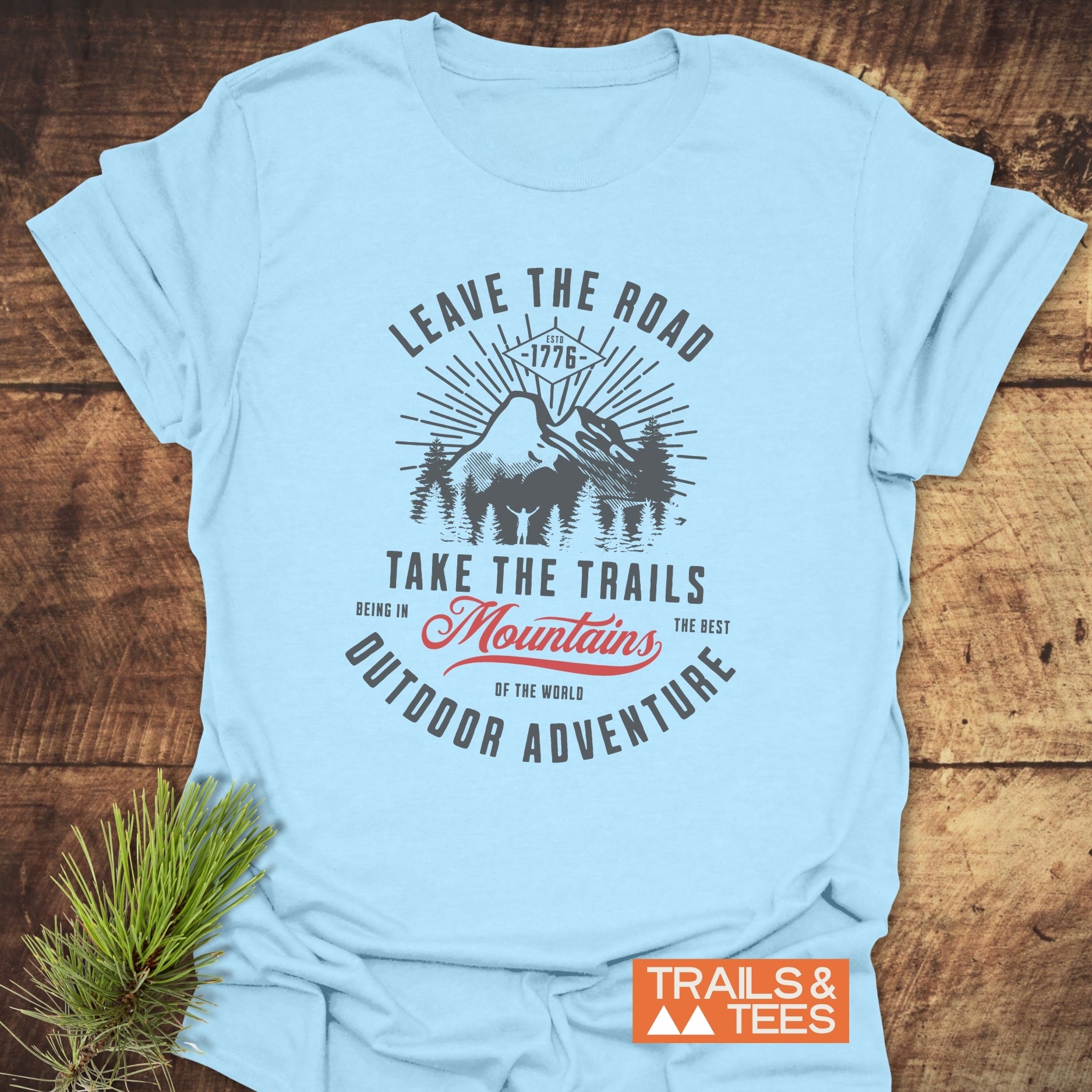 Close-up of the Leave The Road T-Shirt featuring bold text design, highlighting the active lifestyle theme.