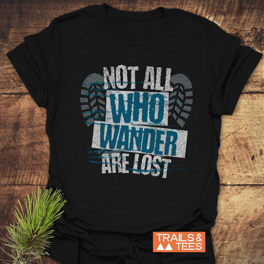 Close-up of a 'Not All Who Wander Are Lost' T-shirt featuring detailed text design, emphasizing its activewear style and casual fit.
