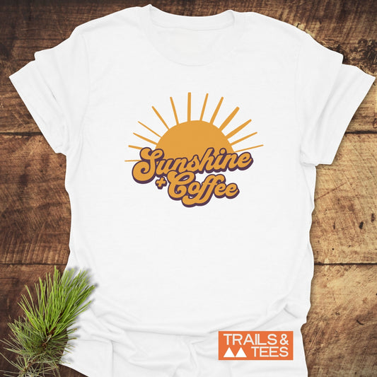 Sunshine And Coffee T-Shirt featuring a yellow sun and orange text, crafted from soft cotton for outdoor adventures, offering comfort and durability with lasting prints.