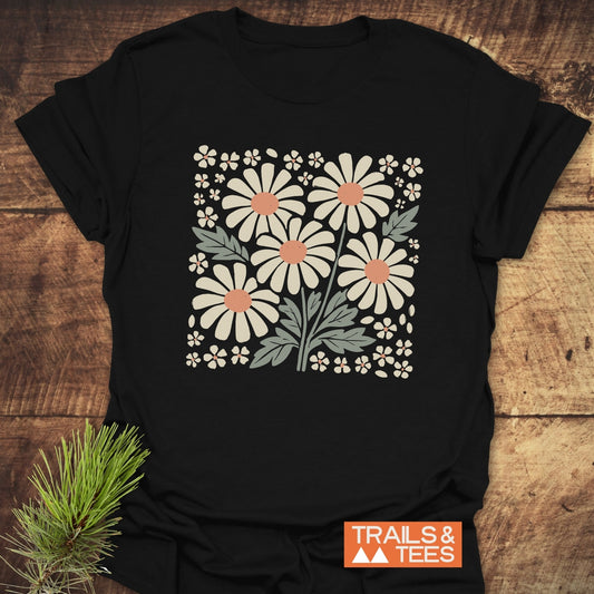 Retro Daisy Love T-Shirt featuring a black base adorned with white floral designs, crafted from soft, lightweight cotton for comfort and durability.