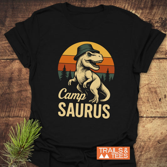 CampSaurus T-Shirt featuring a cartoon dinosaur with a hat, crafted from soft cotton for outdoor adventures. Pre-shrunk with durable prints.
